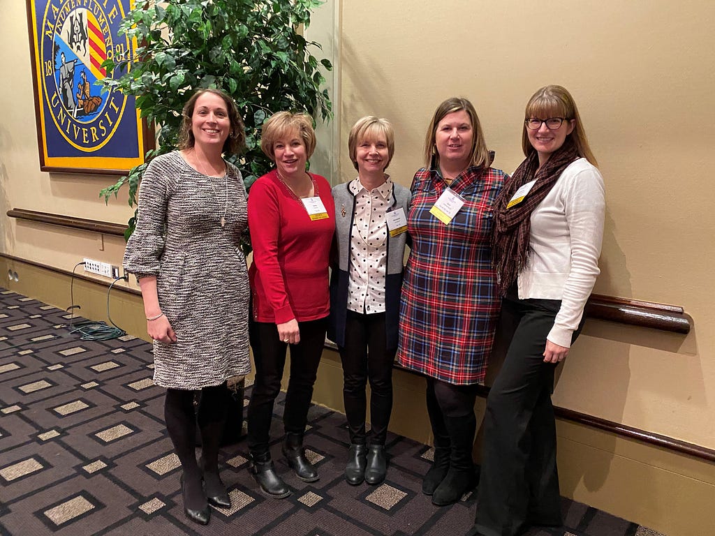 AMUW Board Members at the 2019 Advent Reflection Luncheon: Molly Jante, Arts ’02, Grad ’03; Kathy Cavalco, Eng ’86; Marybeth Jacobson, Jour ’81; Sara Andrew Buell, Bus Ad ’00, Law ’06; Rebecca Parker Fedewa, Grad ’03, ’12