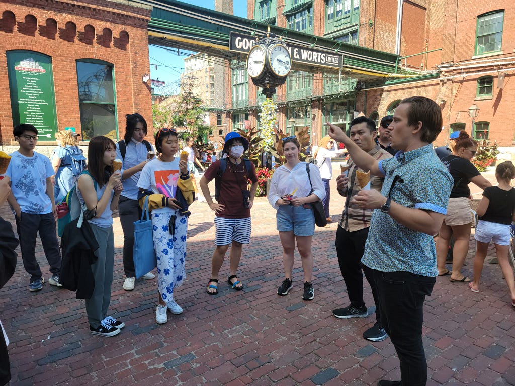 The SvN team leading a walk around Distillery District with our 1UP Office Tour participants.