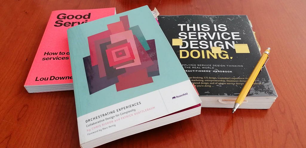 Books about service design: “Good Services”, “Orchestrating experiences” and “This is service design doing”.