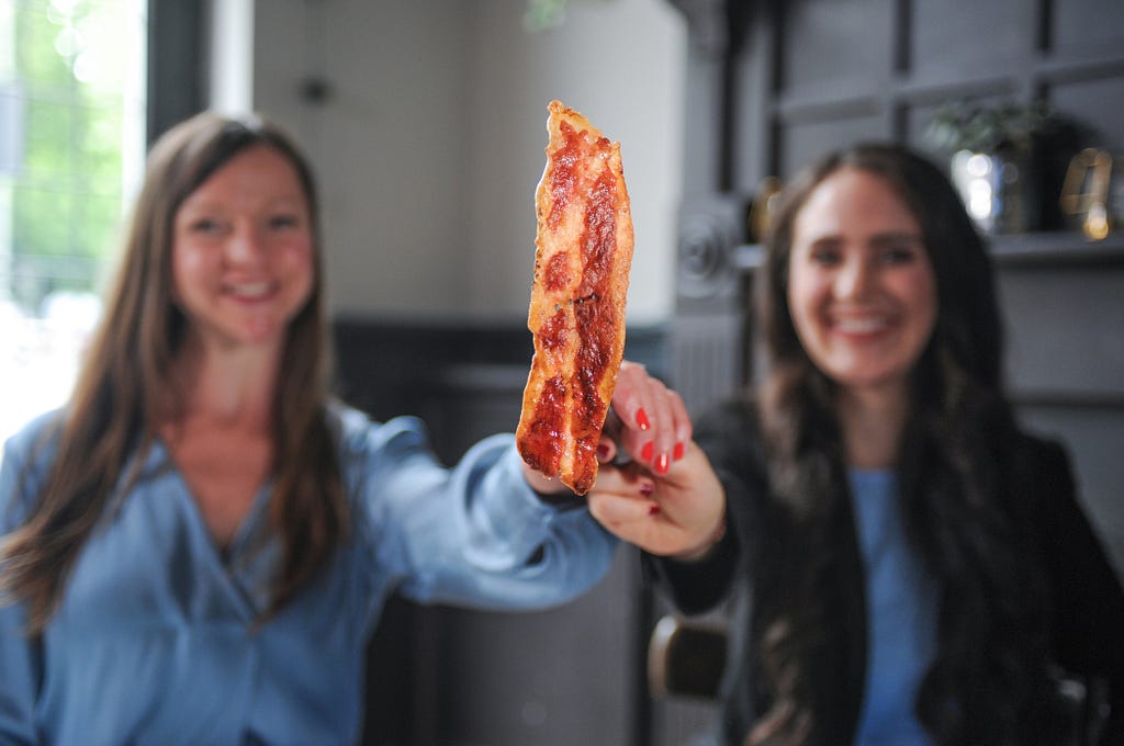 Higher Steaks Chief Scientific Officer Dr Ruth Helen Faram and CEO Benjamina Bollag with their lab-grown bacon