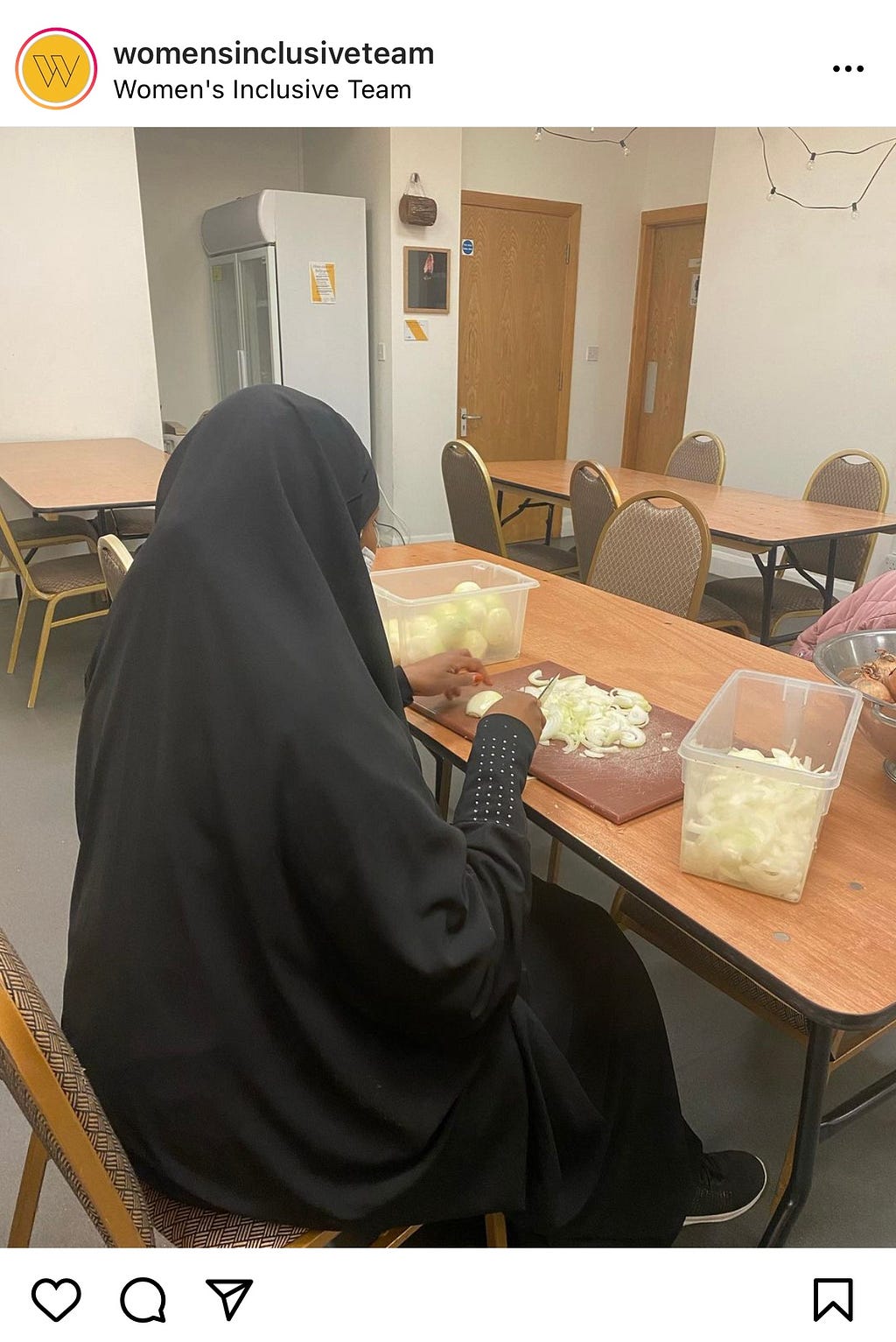A woman volunteer is pictured chopping onions for the Hooyo East Takeaway service which supports the Women’s Inclusive Team.