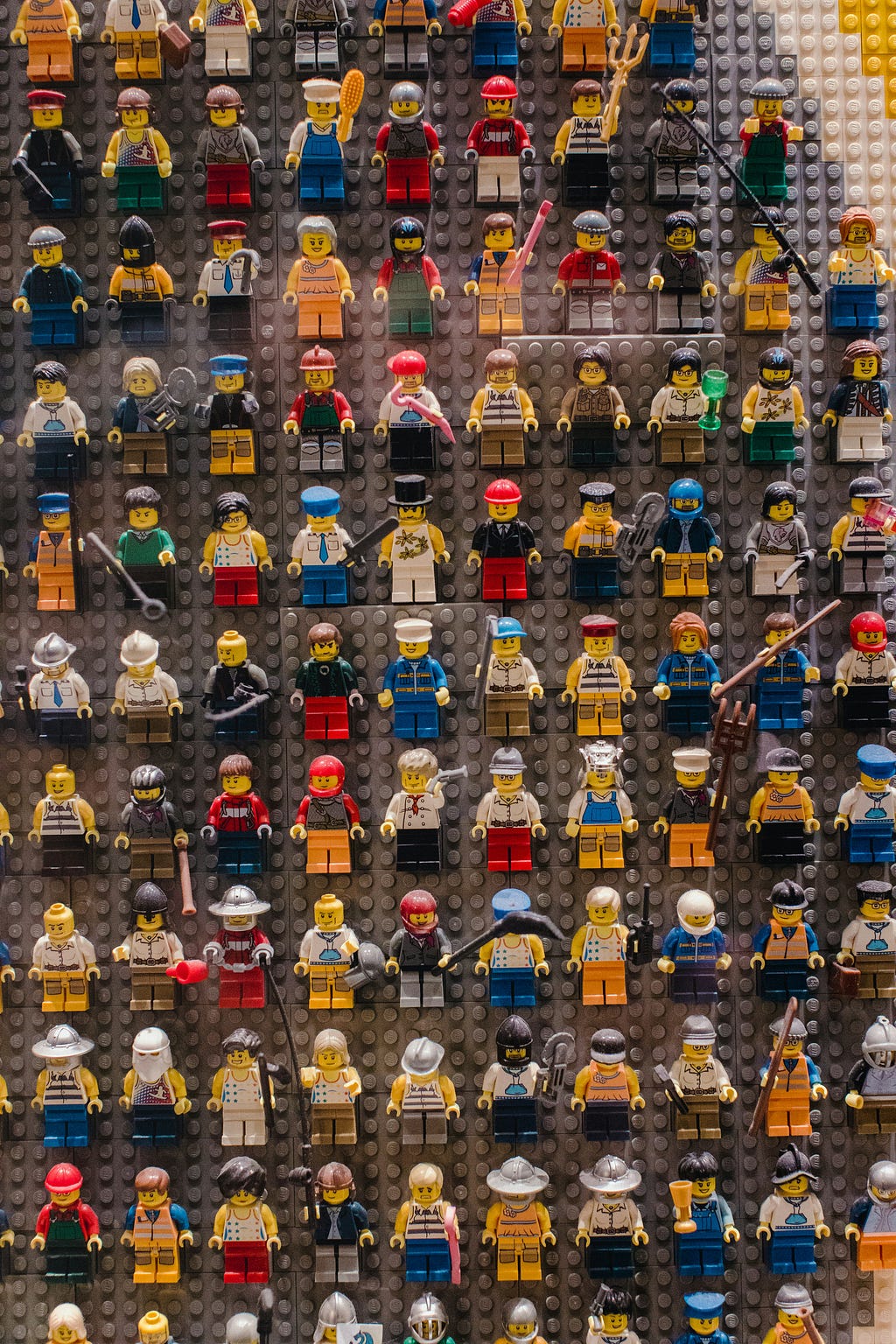 A display case with different lego figurines showcasing user variety and the importance of knowing the target user when making UX decisions