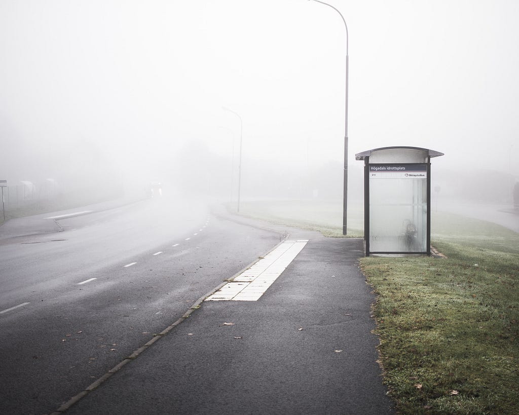 Image showing a bus stop in a foogy day in country side, no people around.