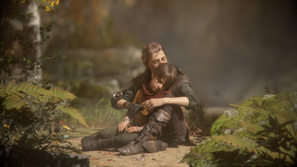 A screenshot from A Plague Tale: Innocence. Amicia and Hugo sit in a forest clearing, Amicia hugging her younger brother.