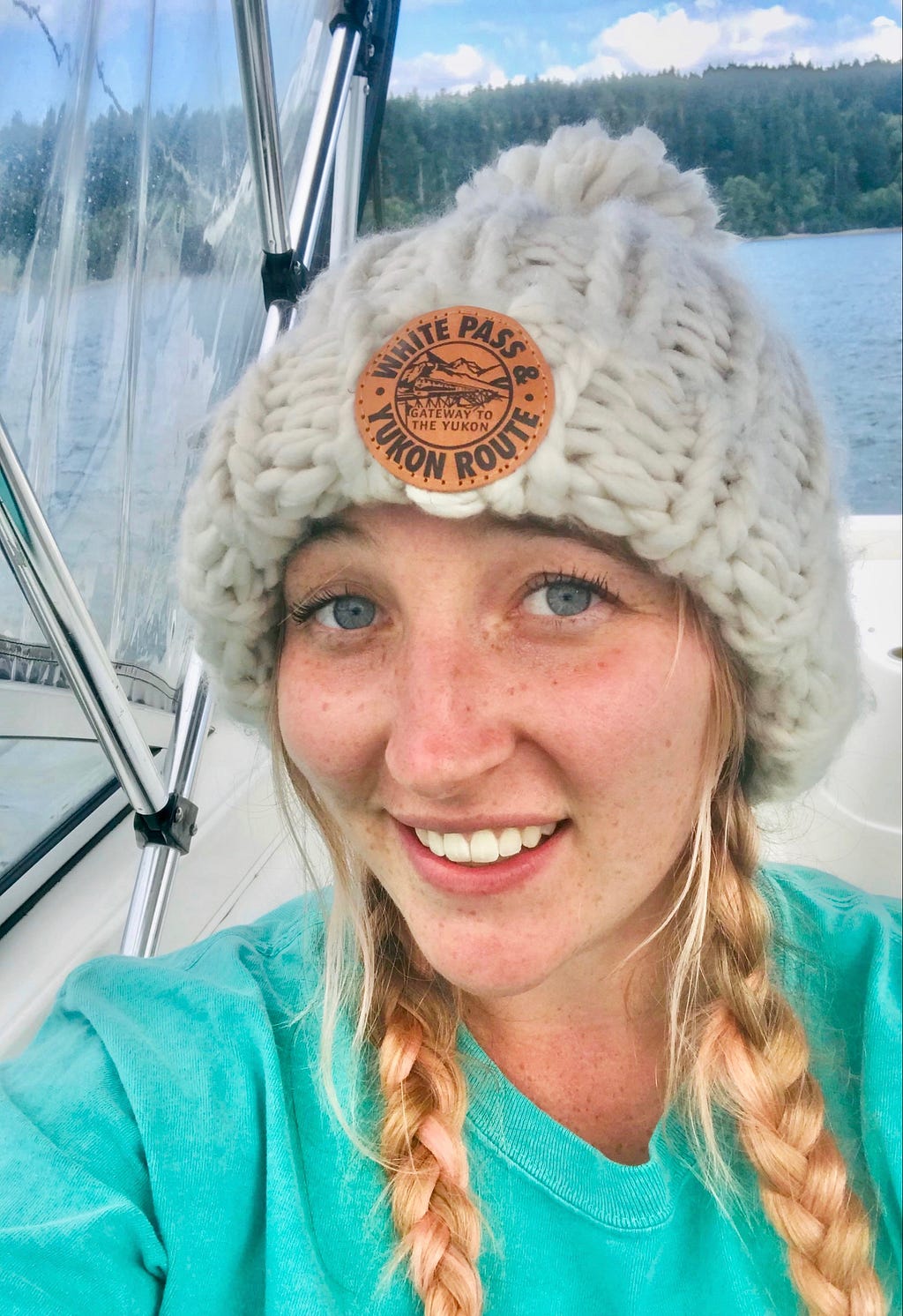 A portrait of Erin Rosenkranz smiling on a boat.