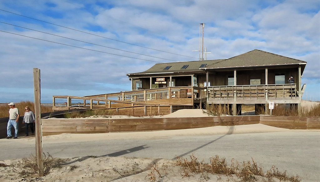 couple leave ramp to building on beachh