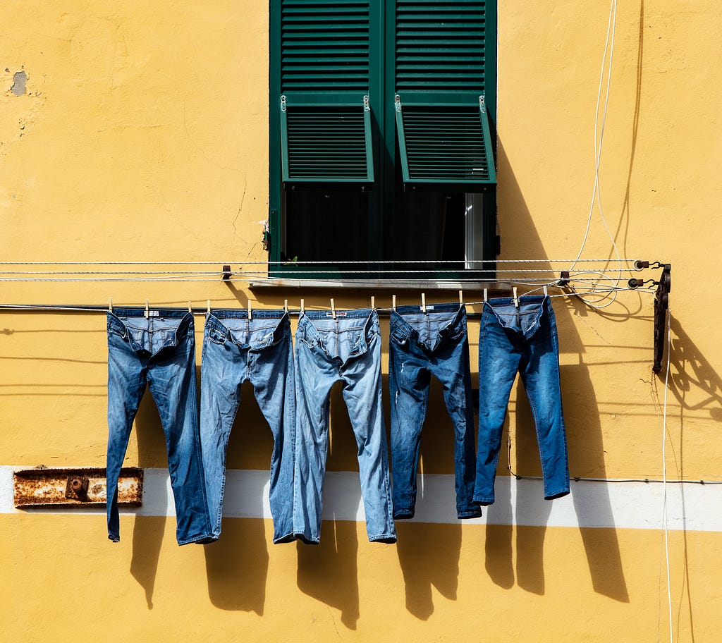 Jeans hanging from a wash line