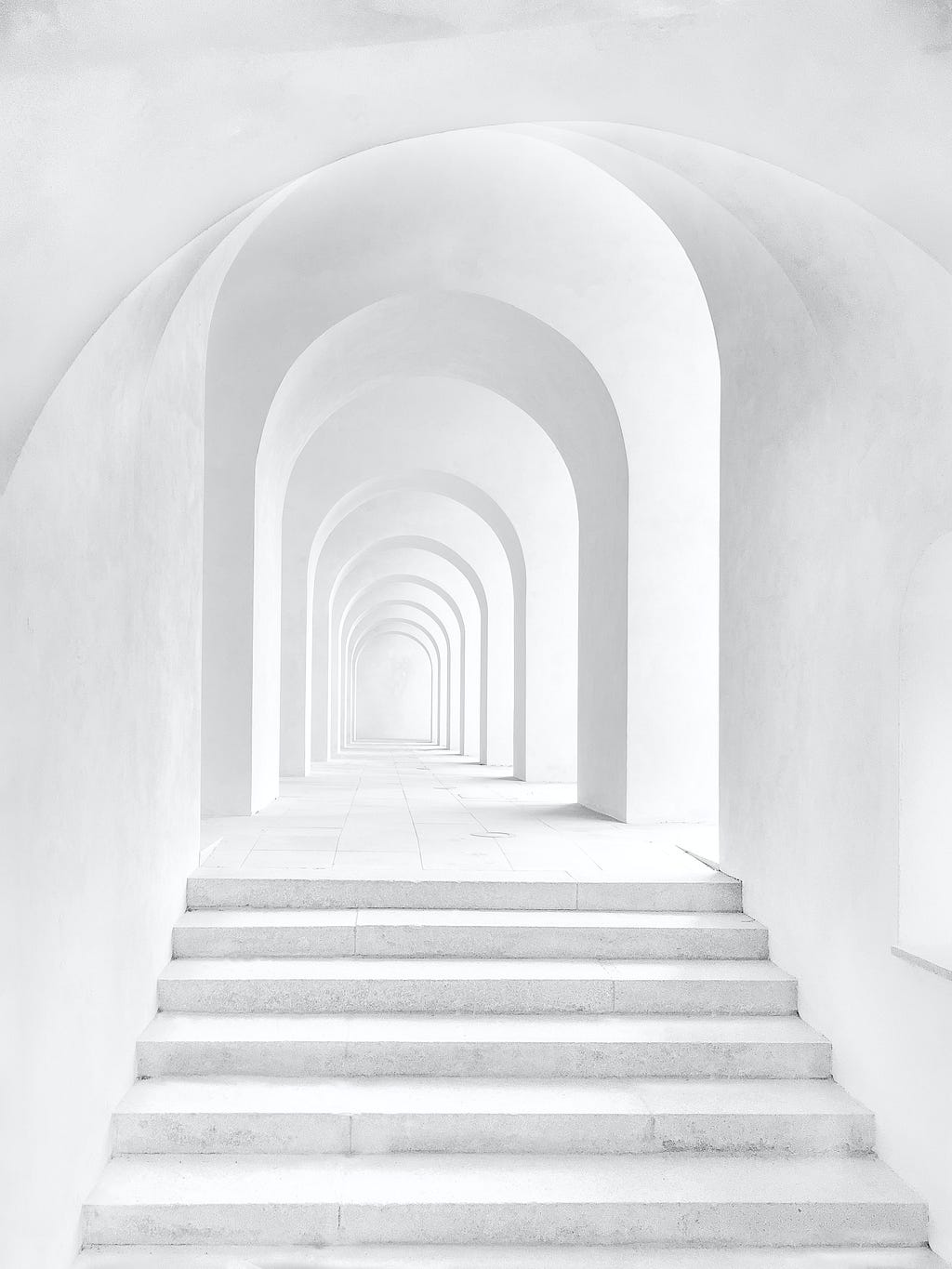 A white marble hall that seems endless