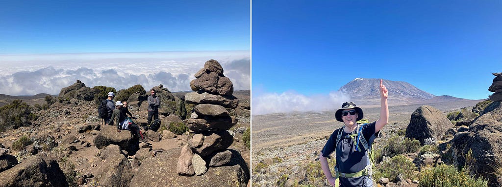 Two side-by-side images of the views from atop Zebra Rocks, with the left image showing hikers chatting with the tops of clouds in the background, and the right image showing the author pointing toward Mount Kilimanjaro’s summit in the background under blue skies.