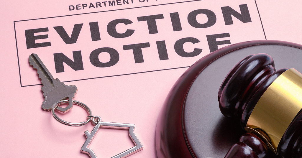 An eviction notice with a key and gavel.