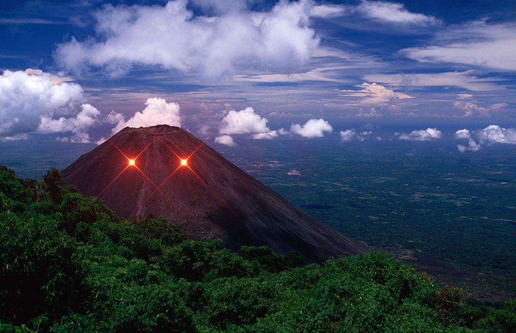 Izalco, an active stratovolcano in El Salvador, with laser eyes.