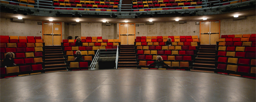 View from a theater stage looking out at empty seats