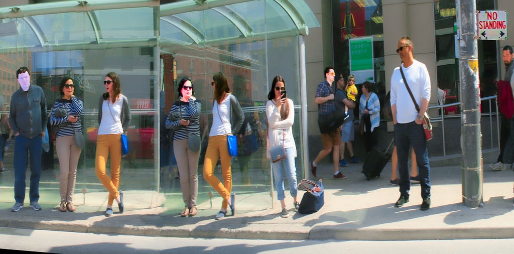 People standing at a bus stop