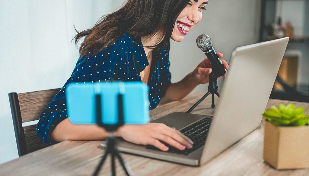 Young content creator, talking on mic for virtual event