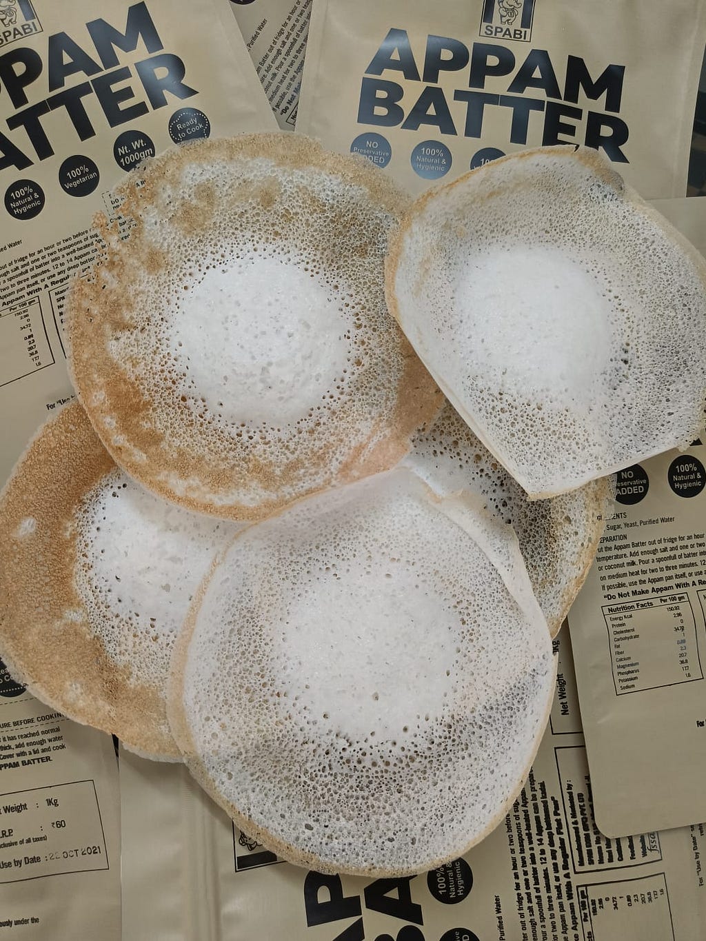 A bowl of appam batter, a traditional South Indian fermented rice and coconut pancake mixture.