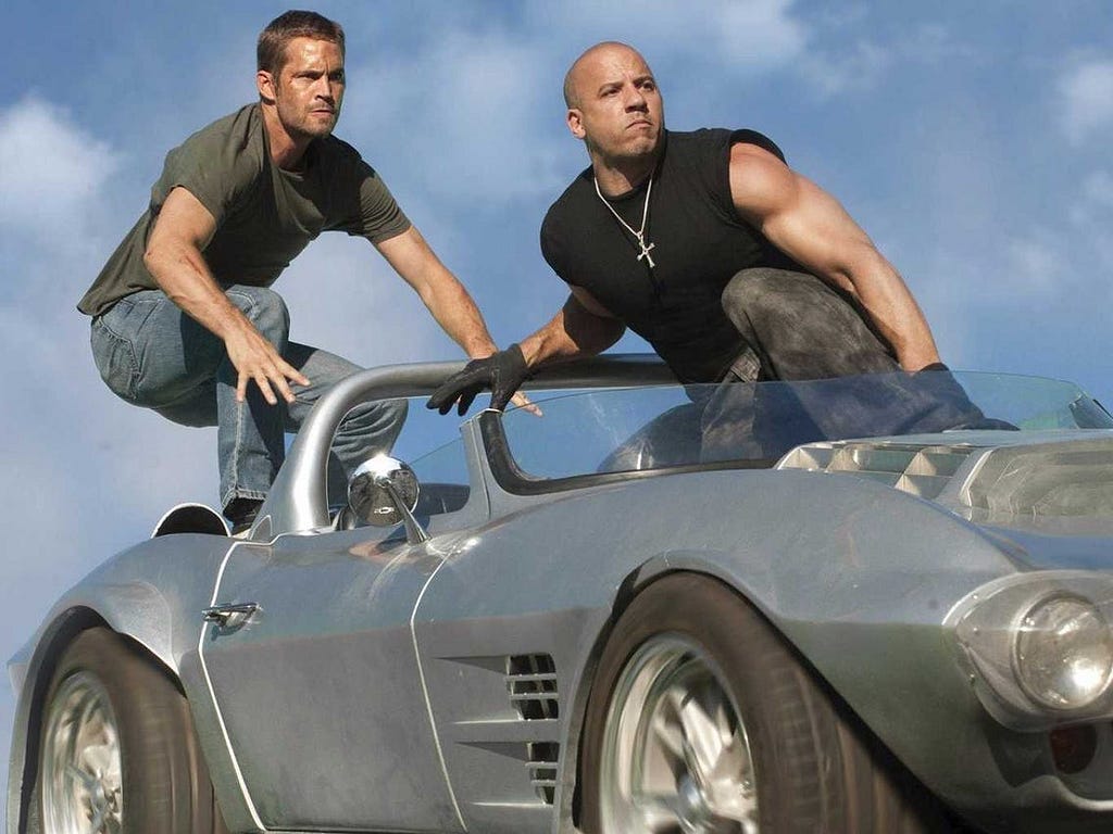 Dominic Toretto and Brian O’Connor about to jump from a car in Fast Five.