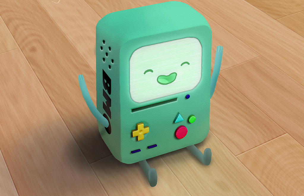This is an image of BMO, the character from Adventure Time. He is a sage green 3D gameboy, with plus, triangle, and circle buttons on front in yellow, blue, and red respectively. His hands are held up in a cheering motion.
