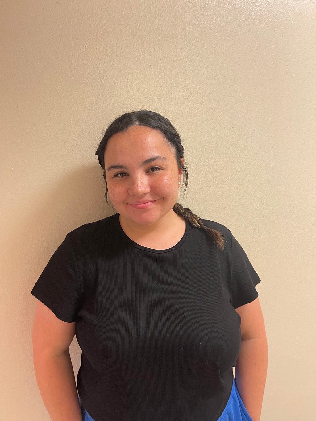 Elise Pinsonneault, senior at Saint Louis University, standing and smiling in the Center for Global Citizenship on Saint Louis Universities’ campus on August 31st, 2022 at 8:30 pm. Photo by Lauren Morby