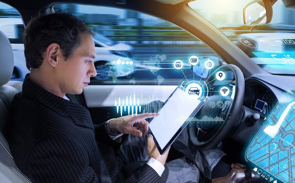 Man reading with eyes off the road as vehicle performs driving tasks