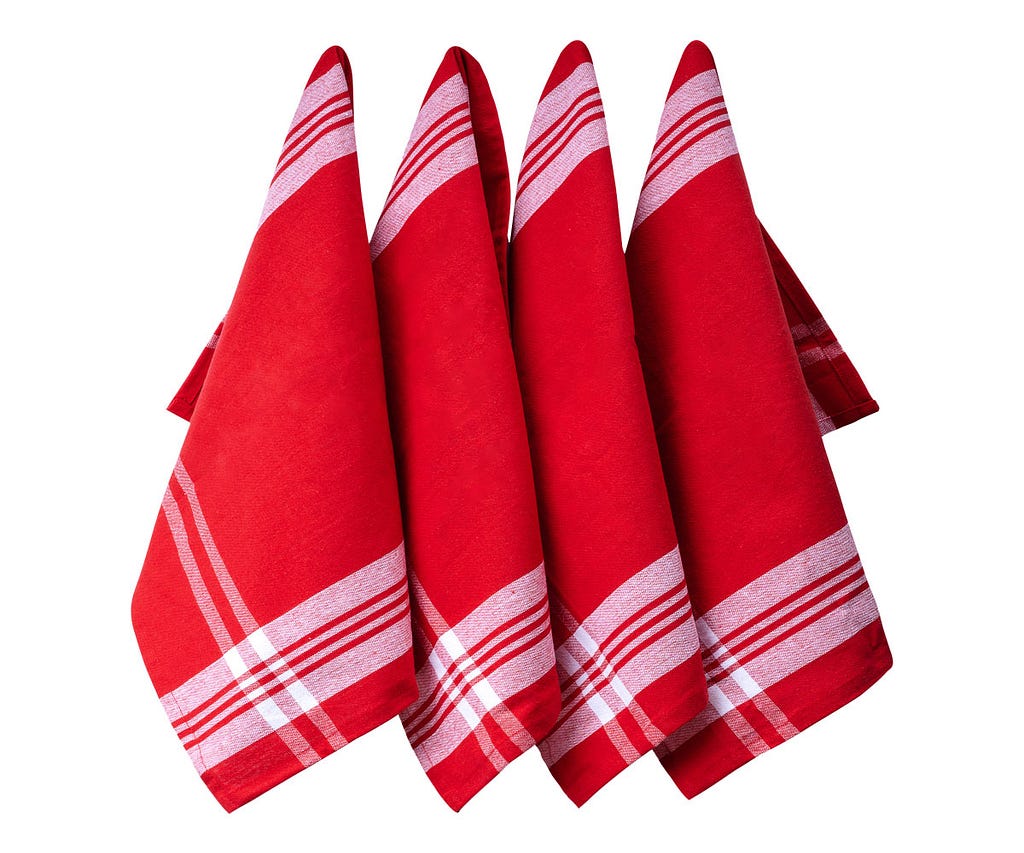 Eco-friendly kitchen hand towels made from organic cotton, folded in a basket