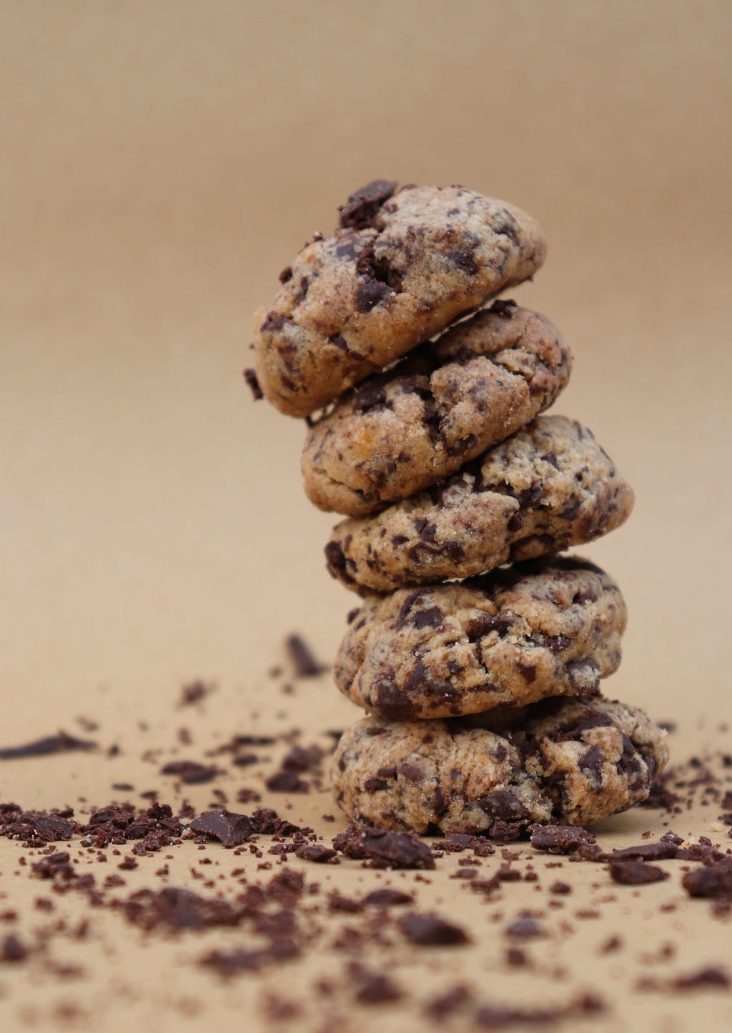 Stack of chocolate chip cookies with crumbs