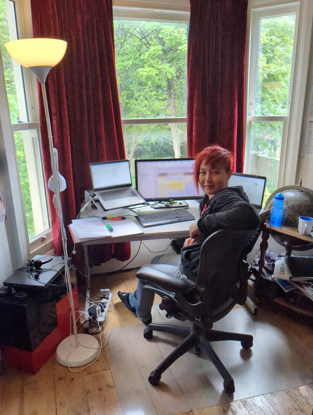 A photo of the author at her desk