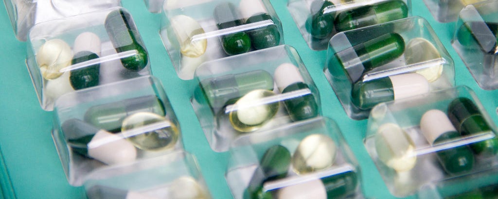 Capsules of vitamins in containers