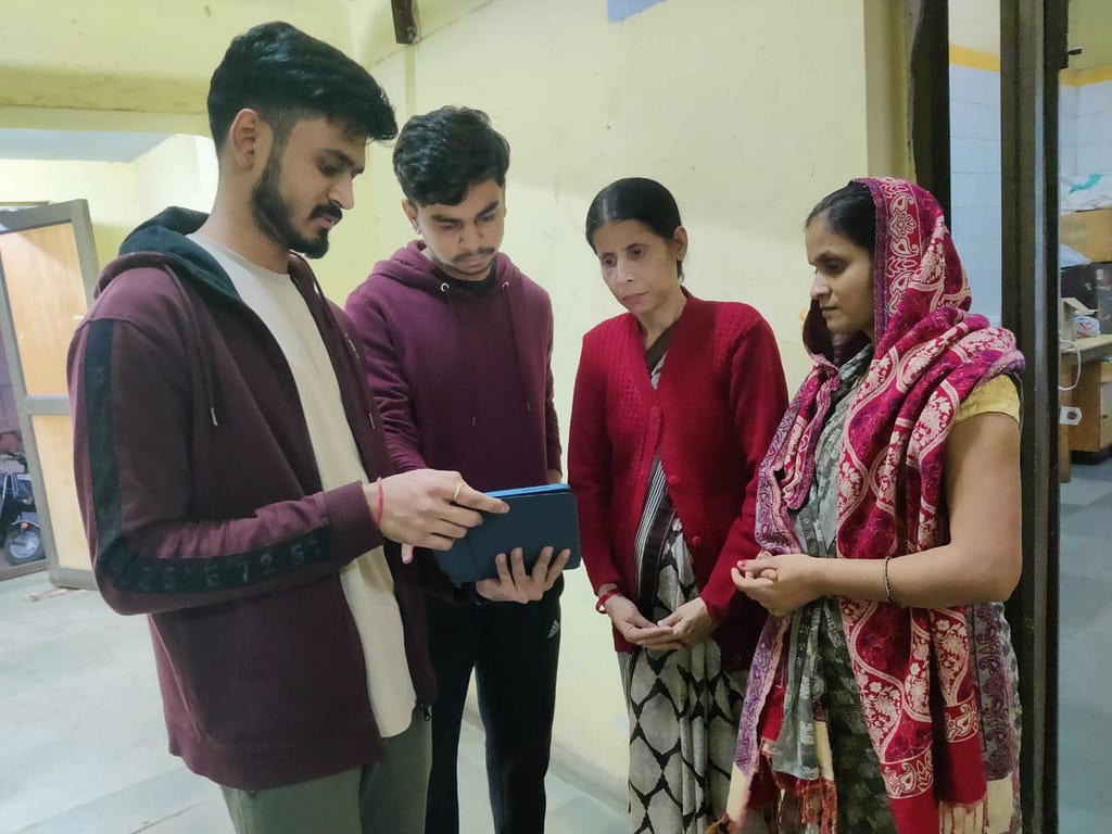 A photograph showing us interacting with some local househelp workers