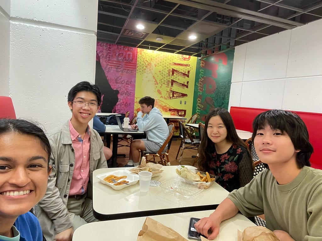 Tulio and 3 other students sitting around a table