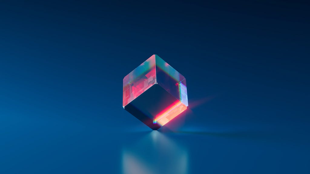 A coloured glass cube on a deep blue background