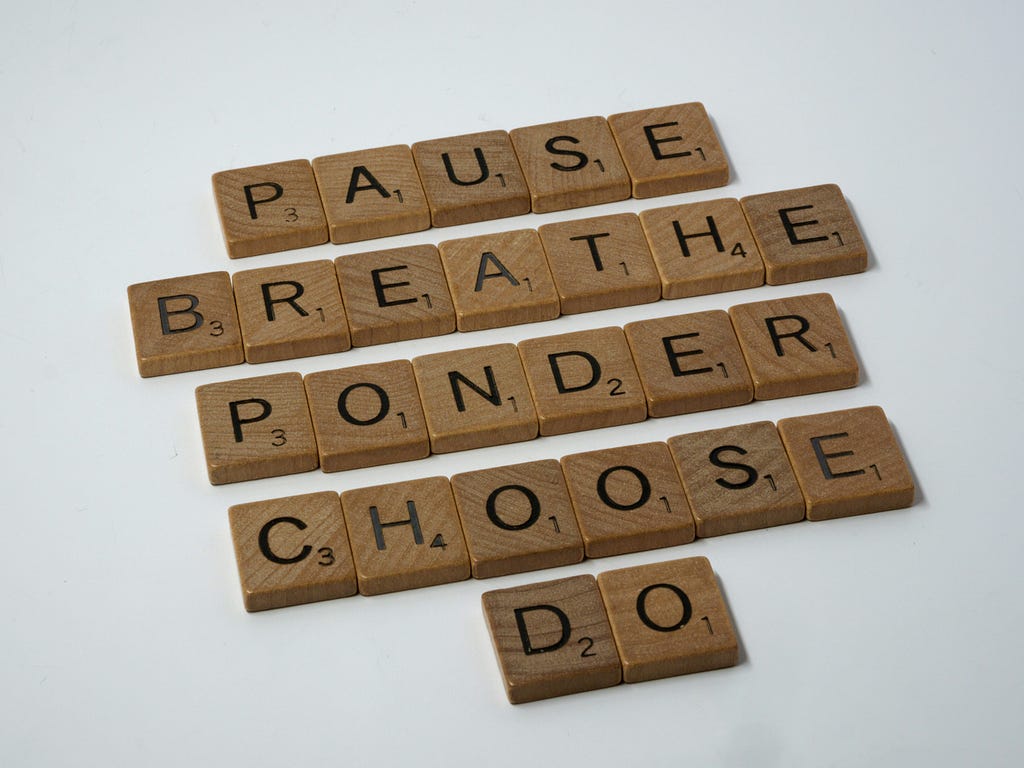 Scrabble pieces spell out: Pause, Breathe, Ponder, Choose, Do