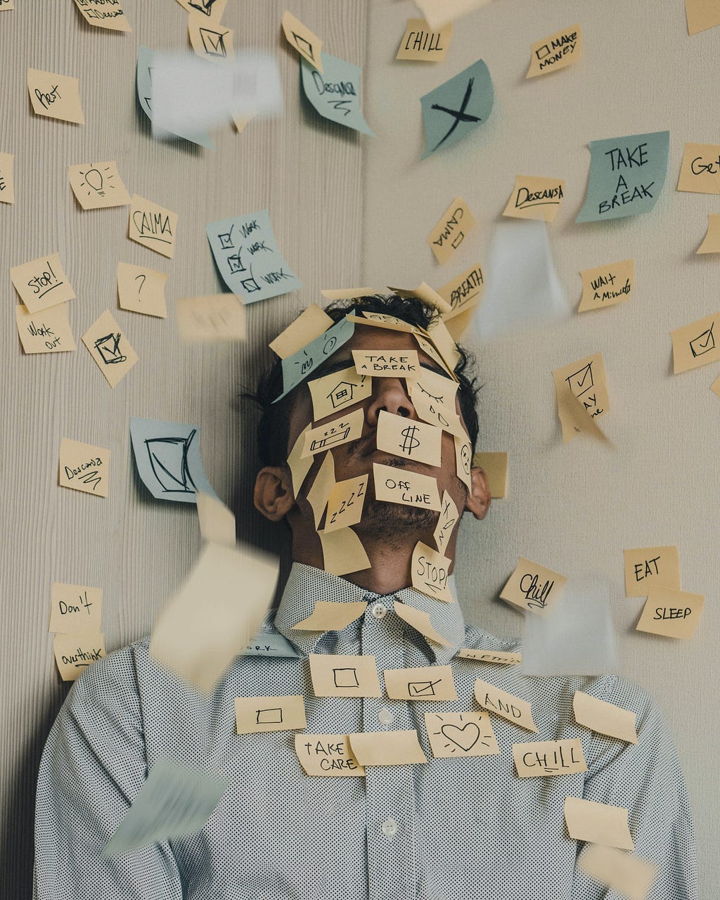 A person covered with Post-it notes