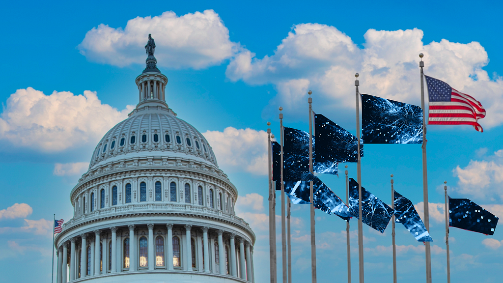 The US Capital Building to the left and, on the right, a half-circle of American flags abstracted into blue digital flags against the blue and white cloud sky.