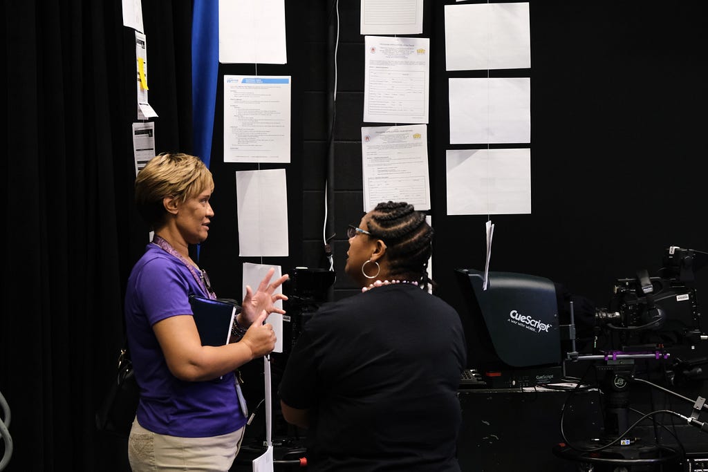 Two city employees identify their forms