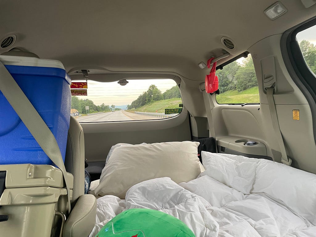 The inside of my van with a mattress and cooler (photo by author)