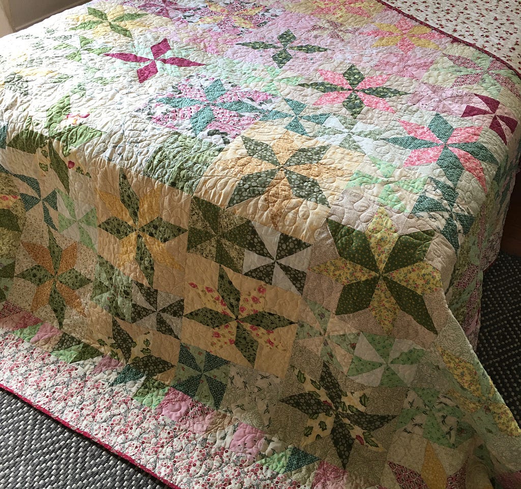 Photo of a quilt on a bed