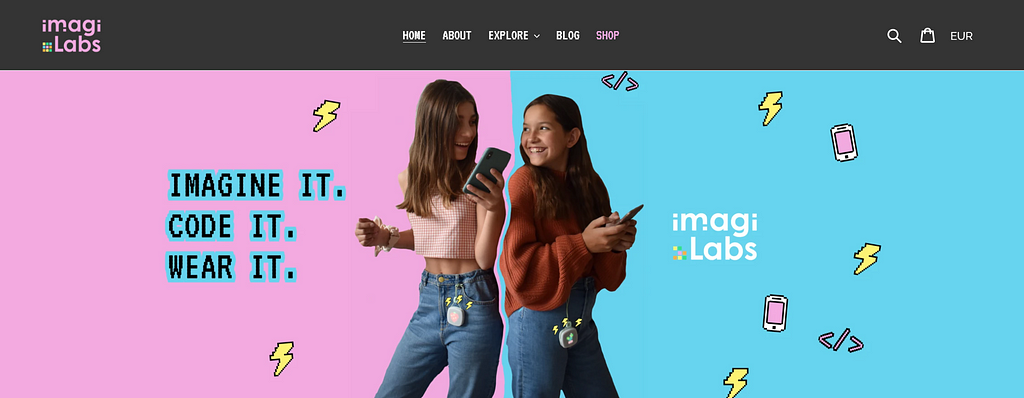 Two young teen girls stand side by side against a colourful background. The text reads: Imagine it, code it, wear it.