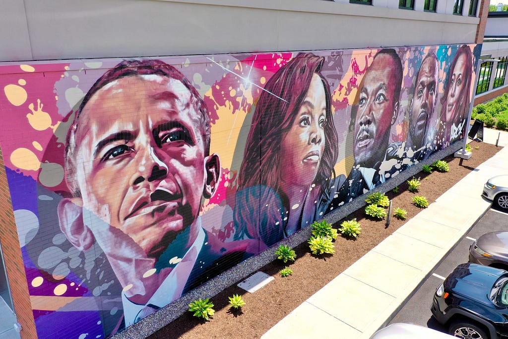 Bloomfield Racial Equity Mural by artist ARCY featuring images of leaders in Black history, including Obama and MLK.