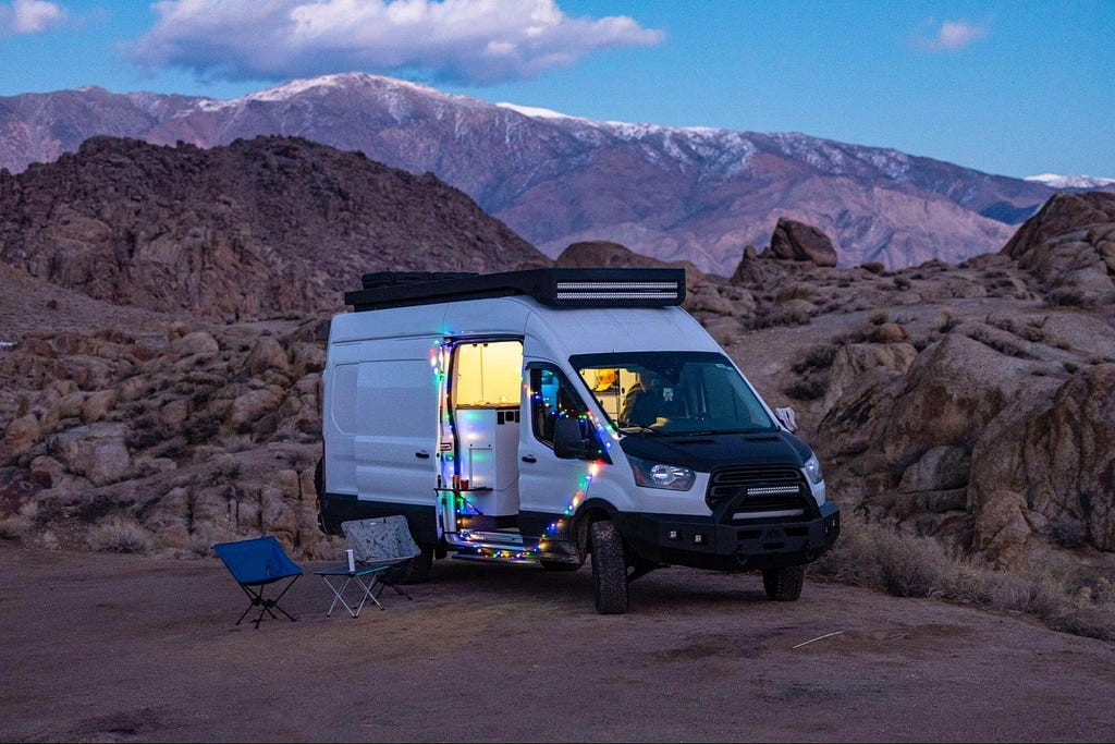 Ford Transit camper van in California with fairy lights