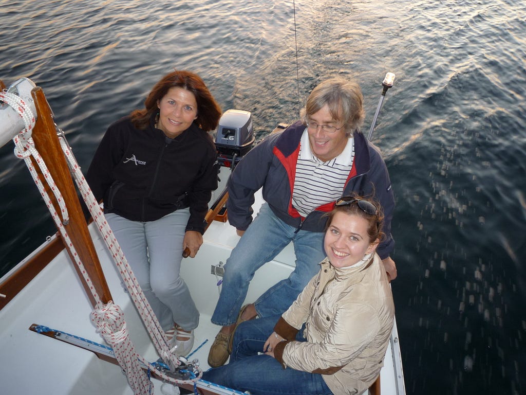 The author sailing with her husband, Rob, her son, Chris (taking the photo) and his then girlfriend, Olga.
