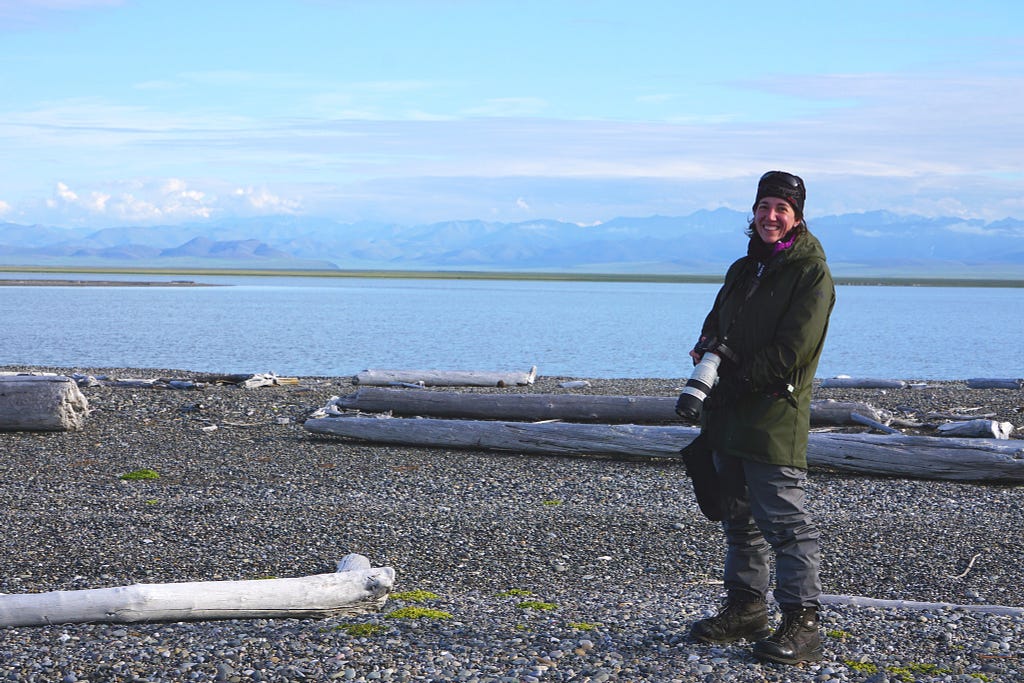 Danielle Brigida, with camera in hand, is happy to be bird watching in Alaska’s wilderness.