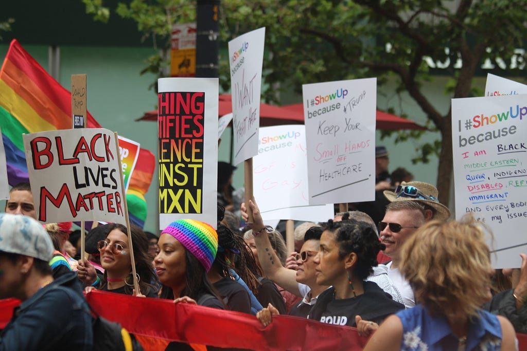 An image of a group of protesters holding a banner during a Black Lives Matter march.