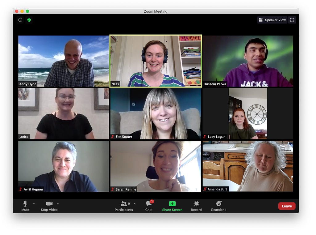 Screenshot of a Zoom call with 9 people, everyone smiling for the photo
