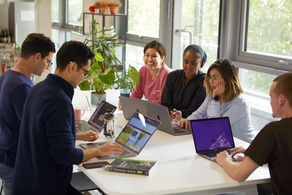 A team planning session around a desk