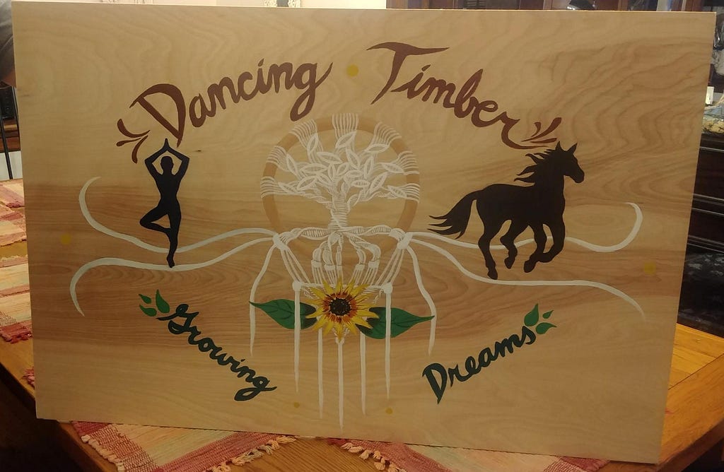 The sign that was made for Dancing Timber with the words “Growing Dreams” on it was commissioned for us by my sister.