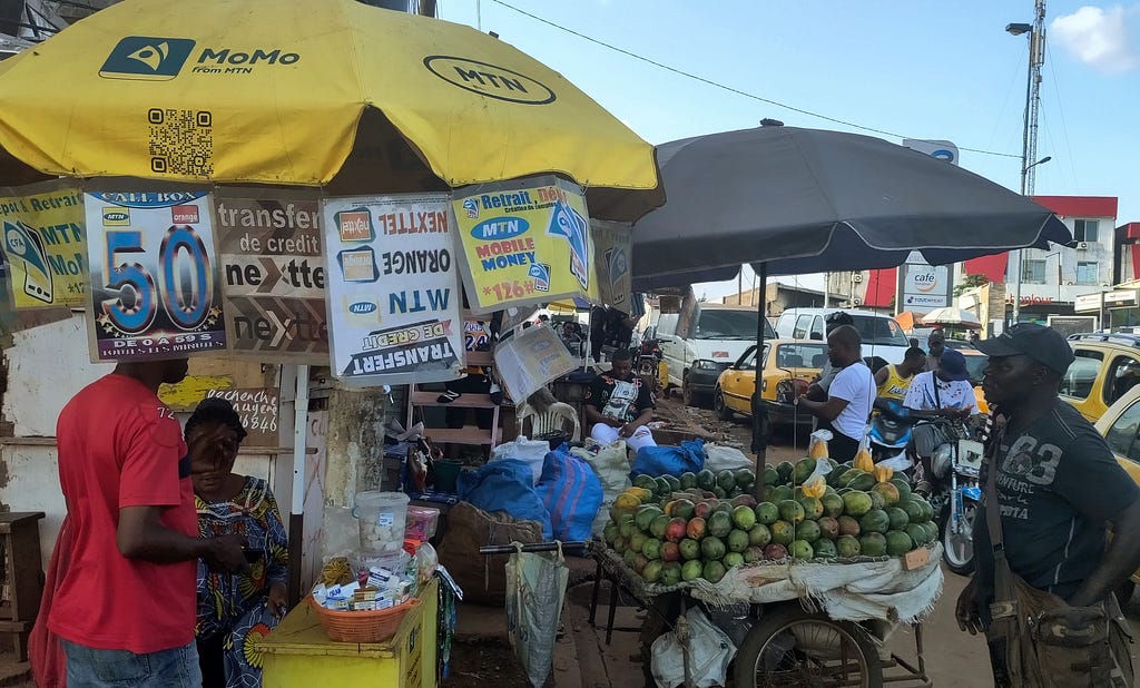Market stall with mobile money signs