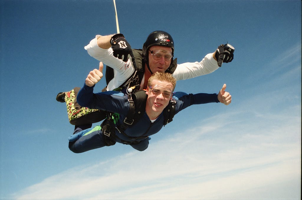 A traveler doing skydiving and conquering his fears and achieving confidence out of it!