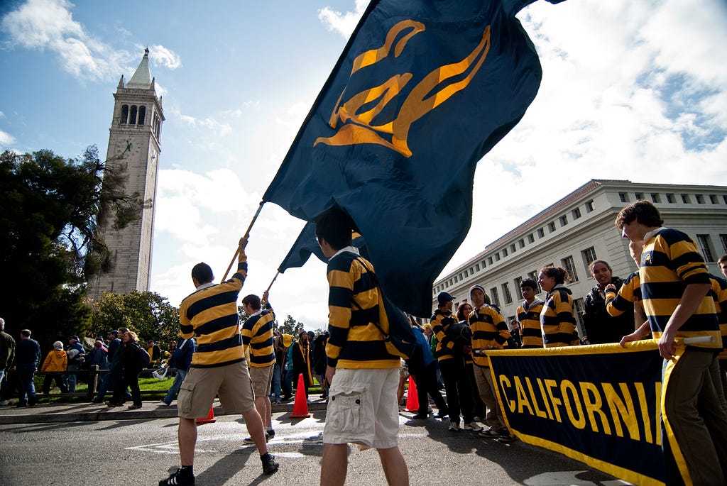 Students waving a Cal flag