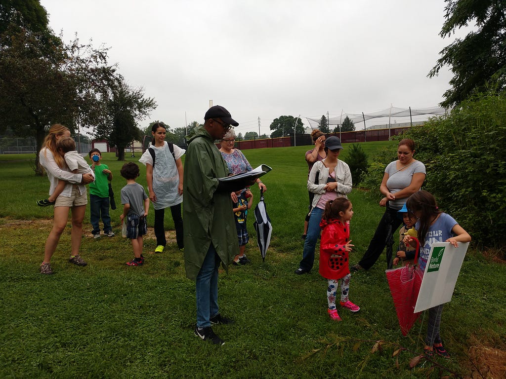 Group of adults and children in a park