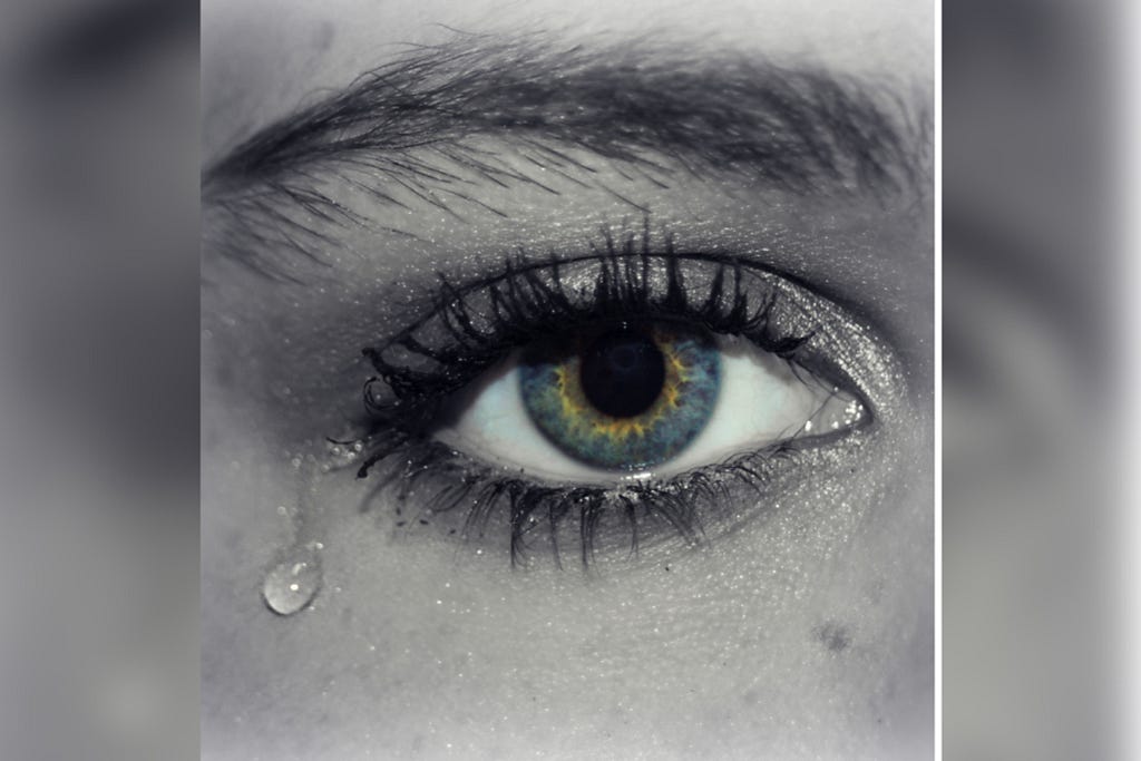 An image of an eye with tears dropping from it to show how hurt some writers are by medium partner program.